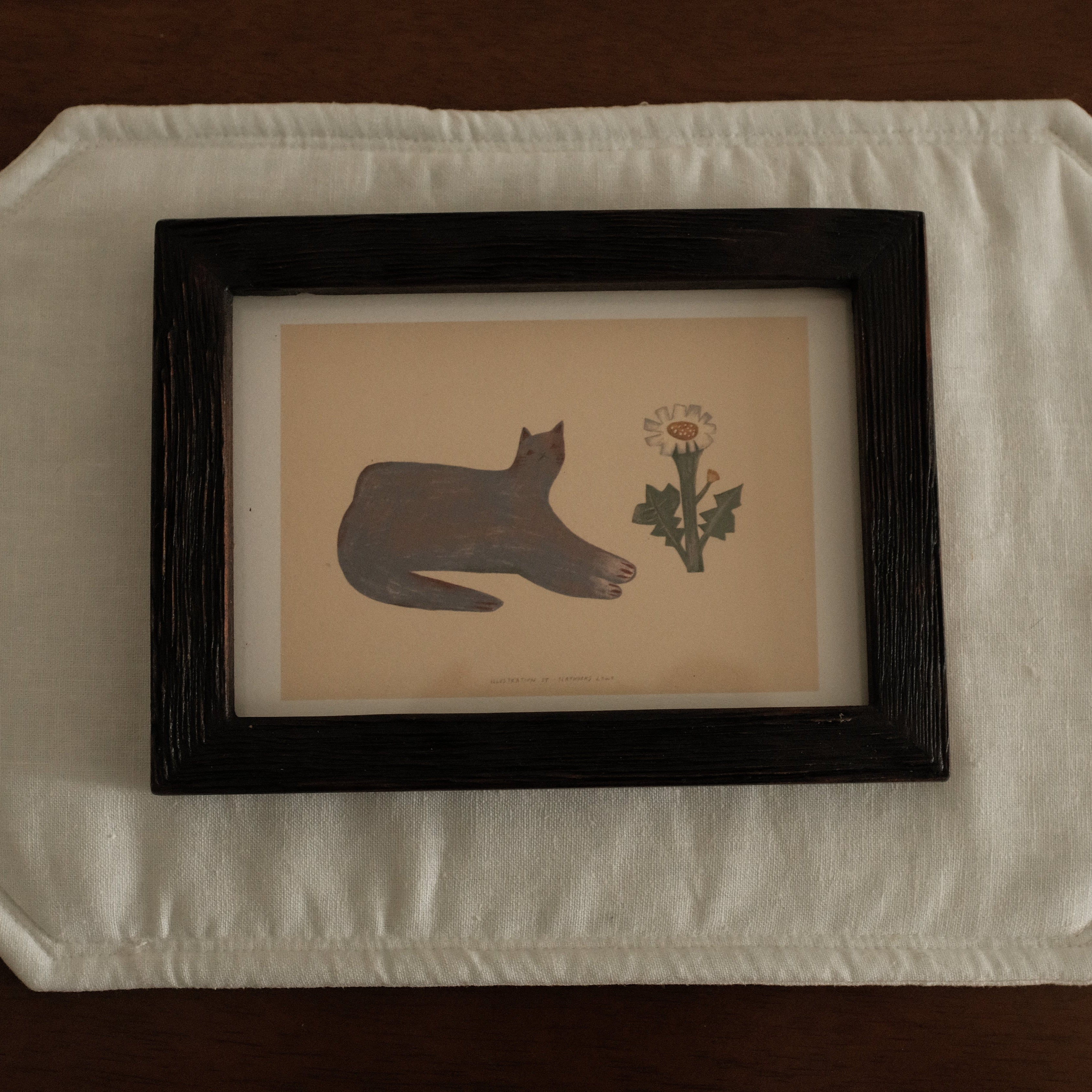 Teak Wood Framed artwork with a cat silhouette and flower on a white surface