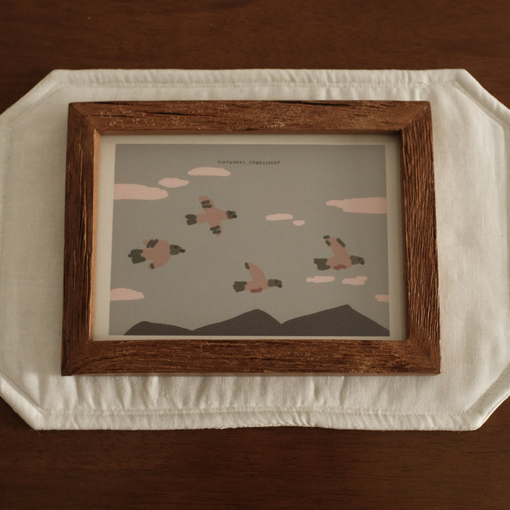 Teak wood Framed artwork on a textured surface with a brown background