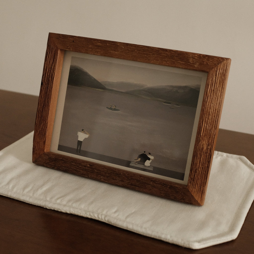 Teak Wood Framed Leisure by the Lake black and white photograph of a landscape with two figures on a wooden surface.
