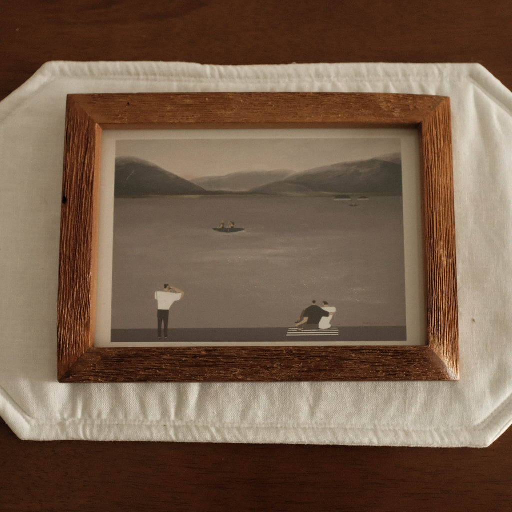 Teak Wood Framed Leisure by the Lake black and white photograph of a landscape with two figures on a wooden surface.